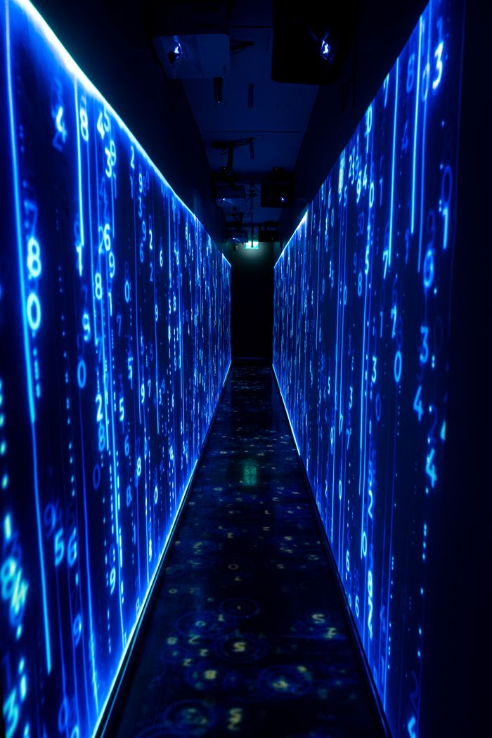 A luminous blue tunnel with digital numbers creating a futuristic, sci-fi ambiance.